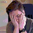 A low-resolution picture of Colby, with his face in his palms in defeat. Big mood.